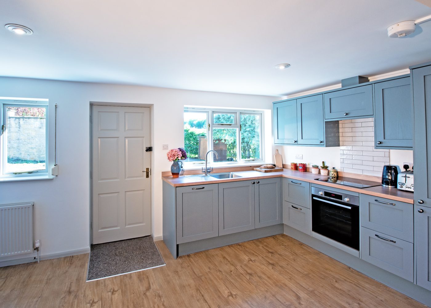 Blue shaker style kitchen at the Far Heath accommodation
